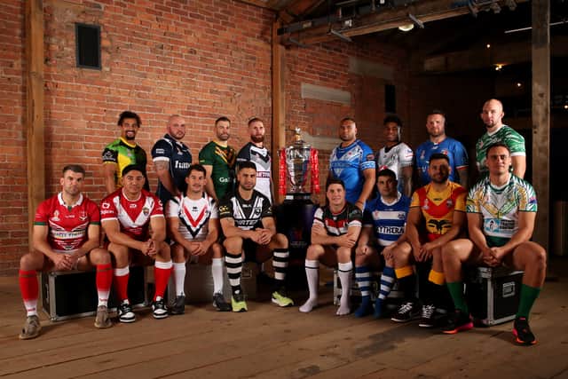 The 16 captains with the Rugby League World Cup Trophy ahead of first round of fixtures