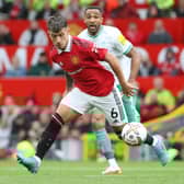 Lisandro Martinez of Manchester United in action with Callum Wilson of Newcastle United (Photo by Tom Purslow/Manchester United via Getty Images)