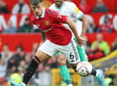 Lisandro Martinez of Manchester United in action with Callum Wilson of Newcastle United (Photo by Tom Purslow/Manchester United via Getty Images)
