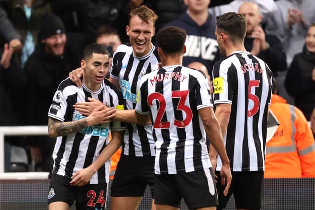 Miguel Almiron of Newcastle United celebrates scoring their side’s first goal with teammates during the Premier League match between Newcastle United and Everton FC at St. James Park on October 19, 2022 in Newcastle upon Tyne, England. 