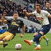 Tottenham Hotspur striker Harry Kane has this shot blocked by Newcastle United’s Fabian Schar (Photo by GLYN KIRK/AFP via Getty Images)
