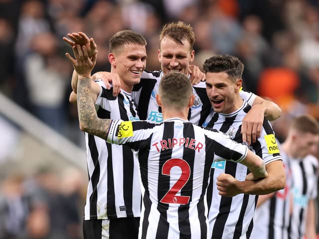 Sven Botman, Kieran Trippier, Dan Burn and Fabian Schar of Newcastle United celebrate their side’s win against Everton (Photo by George Wood/Getty Images)