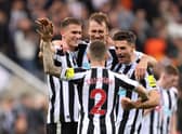 Sven Botman, Kieran Trippier, Dan Burn and Fabian Schar of Newcastle United celebrate their side’s win against Everton (Photo by George Wood/Getty Images)
