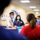 Prime Minister Rishi Sunak speaks with members of staff as he visits Croydon University hospital on October 28, 2022 in London, England. The Prime Minister is reported to be reviewing proposals for next monthâs autumn statement, in a bid to raise up to Â£50 billion a year through a combination of spending cuts and tax rises. 