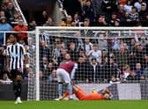 Aston Villa goalkeeper Emi Martinez goes down injured against Newcastle United. (Photo by Stu Forster/Getty Images)