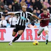 Emi Buendia of Aston Villa is challenged by Newcastle United’s Brazilian duo Joelinton and Bruno Guimaraes  (Photo by Nigel Roddis/Getty Images)