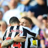 Newcastle United duo Kieran Trippier and Miguel Almiron. (Photo by LINDSEY PARNABY/AFP via Getty Images)