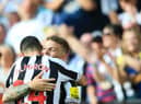 Newcastle United duo Kieran Trippier and Miguel Almiron. (Photo by LINDSEY PARNABY/AFP via Getty Images)