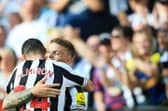 Newcastle United duo Kieran Trippier and Miguel Almiron. (Photo by LINDSEY PARNABY/AFP via Getty Images)