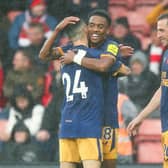 Joe Willock celebrates with Miguel Almiron after scoring Newcastle United’s third goal during their win at Southampton (Photo by Charlie Crowhurst/Getty Images)