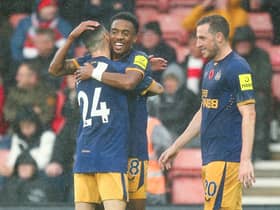 Joe Willock celebrates with Miguel Almiron after scoring Newcastle United’s third goal during their win at Southampton (Photo by Charlie Crowhurst/Getty Images)