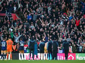 Newcastle United fans celebrate after their sides victory during the Premier League match between Southampton FC and Newcastle United at Friends Provident St. Mary’s Stadium on November 06, 2022 in Southampton, England. 