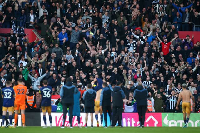 Newcastle United fans celebrate after their sides victory during the Premier League match between Southampton FC and Newcastle United at Friends Provident St. Mary’s Stadium on November 06, 2022 in Southampton, England.