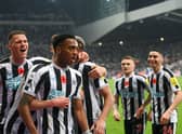 Joe Willock of Newcastle United celebrates after scoring their team’s first goal during the Premier League match between Newcastle United and Chelsea FC at St. James Park on November 12, 2022 in Newcastle upon Tyne, England.