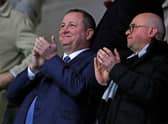 Former Newcastle United’s English owner Mike Ashley (L) and director Lee Charnley (R) applaud after Newcastle take the lead during the FA Cup fourth round replay football match between Oxford United and Newcastle United at the Kassam Stadium in Oxford, west of London, on February 4, 2020. 