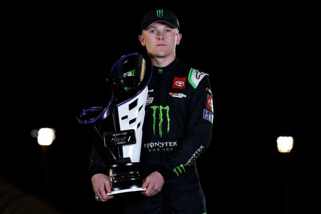 Ty Gibbs, driver of the #54 Monster Energy Toyota, poses with the 2022 NASCAR Xfinity Series Championship trophy after winning the NASCAR Xfinity Series Championship at Phoenix Raceway on November 05, 2022 in Avondale, Arizona. (Photo by Meg Oliphant/Getty Images)