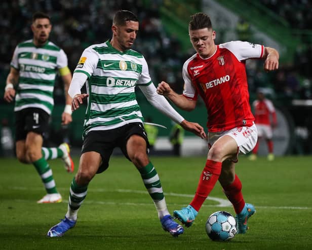 Sporting Braga forward Vitinha vies with Sporting’s Moroccan defender Zouhair Feddal (Photo by CARLOS COSTA / AFP) (Photo by CARLOS COSTA/AFP via Getty Images)