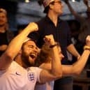 Football fans celebrate while watching the live broadcast of the final of the 2020 UEFA European Championships between England and Italy in the Oxford Arms pub in Camden on July 11, 2021 in London.