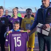 Tomasz’s Oleszaks family were presented with a book of condolence and football shirt