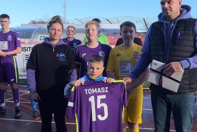 Tomasz’s Oleszaks family were presented with a book of condolence and football shirt
