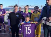 Tomasz’s Oleszaks family were presented with a book of condolence and football shirt