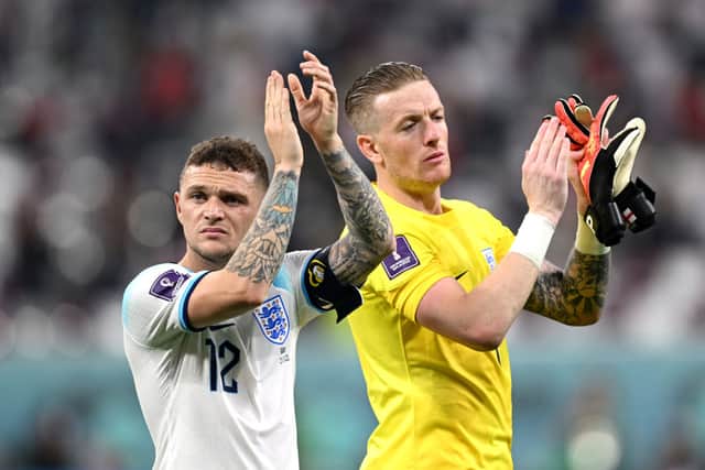 Kieran Trippier and Jordan Pickford of England celebrate after their side’s victory during the FIFA World Cup Qatar 2022 Group B match between England and IR Iran at Khalifa International Stadium on November 21, 2022 in Doha, Qatar.
