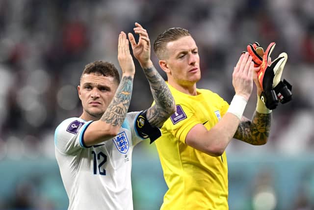 Kieran Trippier and Jordan Pickford of England celebrate after their side’s victory during the FIFA World Cup Qatar 2022 Group B match between England and IR Iran at Khalifa International Stadium on November 21, 2022 in Doha, Qatar. 