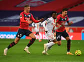 Lens’s midfielder Kalimuendo  vies with Lille’s Sven Botman and Jose Fonte (Photo by DENIS CHARLET/AFP via Getty Images)