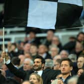 Mehrdad Ghodoussi, husband of Newcastle United’s English minority owner Amanda Staveley waves a flag in the crowd ahead of the English Premier League football match between Newcastle United and Wolverhampton Wanderers at St James’ Park in Newcastle-upon-Tyne, north east England on April 8, 2022. - RESTRICTED TO EDITORIAL USE. No use with unauthorized audio, video, data, fixture lists, club/league logos or ‘live’ services. Online in-match use limited to 120 images. An additional 40 images may be used in extra time. No video emulation. Social media in-match use limited to 120 images. An additional 40 images may be used in extra time. No use in betting publications, games or single club/league/player publications. (Photo by Lindsey Parnaby / AFP) / RESTRICTED TO EDITORIAL USE. No use with unauthorized audio, video, data, fixture lists, club/league logos or ‘live’ services. Online in-match use limited to 120 images. An additional 40 images may be used in extra time. No video emulation. Social media in-match use limited to 120 images. An additional 40 images may be used in extra time. No use in betting publications, games or single club/league/player publications. / RESTRICTED TO EDITORIAL USE. No use with unauthorized audio, video, data, fixture lists, club/league logos or ‘live’ services. Online in-match use limited to 120 images. An additional 40 images may be used in extra time. No video emulation. Social media in-match use limited to 120 images. An additional 40 images may be used in extra time. No use in betting publications, games or single club/league/player publications. (Photo by LINDSEY PARNABY/AFP via Getty Images)