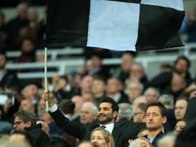 Mehrdad Ghodoussi, husband of Newcastle United’s English minority owner Amanda Staveley waves a flag in the crowd ahead of the English Premier League football match between Newcastle United and Wolverhampton Wanderers at St James’ Park in Newcastle-upon-Tyne, north east England on April 8, 2022. - RESTRICTED TO EDITORIAL USE. No use with unauthorized audio, video, data, fixture lists, club/league logos or ‘live’ services. Online in-match use limited to 120 images. An additional 40 images may be used in extra time. No video emulation. Social media in-match use limited to 120 images. An additional 40 images may be used in extra time. No use in betting publications, games or single club/league/player publications. (Photo by Lindsey Parnaby / AFP) / RESTRICTED TO EDITORIAL USE. No use with unauthorized audio, video, data, fixture lists, club/league logos or ‘live’ services. Online in-match use limited to 120 images. An additional 40 images may be used in extra time. No video emulation. Social media in-match use limited to 120 images. An additional 40 images may be used in extra time. No use in betting publications, games or single club/league/player publications. / RESTRICTED TO EDITORIAL USE. No use with unauthorized audio, video, data, fixture lists, club/league logos or ‘live’ services. Online in-match use limited to 120 images. An additional 40 images may be used in extra time. No video emulation. Social media in-match use limited to 120 images. An additional 40 images may be used in extra time. No use in betting publications, games or single club/league/player publications. (Photo by LINDSEY PARNABY/AFP via Getty Images)
