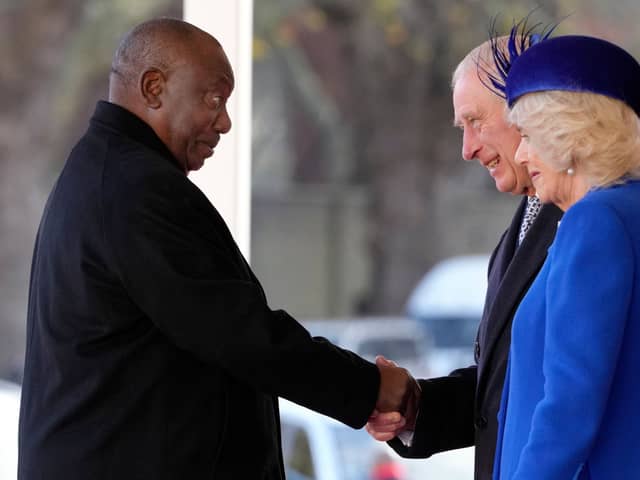 South Africa's President Cyril Ramaphosa is greeted by Britain's King Charles III and Britain's Camilla, Queen Consort 