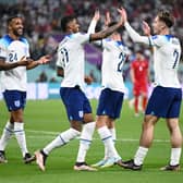 Jack Grealish celebrates with Callum Wilson and Marcus Rashford  after scoring their team’s sixth goal during the FIFA World Cup Qatar 2022 Group B match between England and IR Iran at Khalifa International Stadium on November 21, 2022 in Doha, Qatar. 