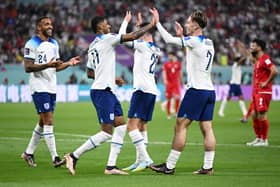 Jack Grealish celebrates with Callum Wilson and Marcus Rashford  after scoring their team’s sixth goal during the FIFA World Cup Qatar 2022 Group B match between England and IR Iran at Khalifa International Stadium on November 21, 2022 in Doha, Qatar. 