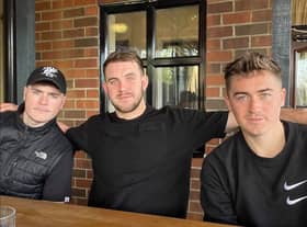 Truman (left) with brothers Hylton (middle) and Myles (right)
