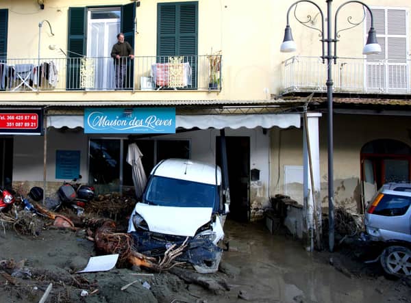 A man looks out from the balcony of his home in Casamicciola on November 27, 2022, following heavy rains that caused a landslide on the island of Ischia, southern Italy. - Italian rescuers were searching for a dozen missing people on the southern island of Ischia after a landslide killed at least one person, as the government scheduled an emergency meeting. A wave of mud and debris swept through the small town of Casamicciola Terme early Saturday morning, engulfing at least one house and sweeping cars down to the sea, local media and emergency services said. (Photo by Eliano IMPERATO / AFP) (Photo by ELIANO IMPERATO/AFP via Getty Images)