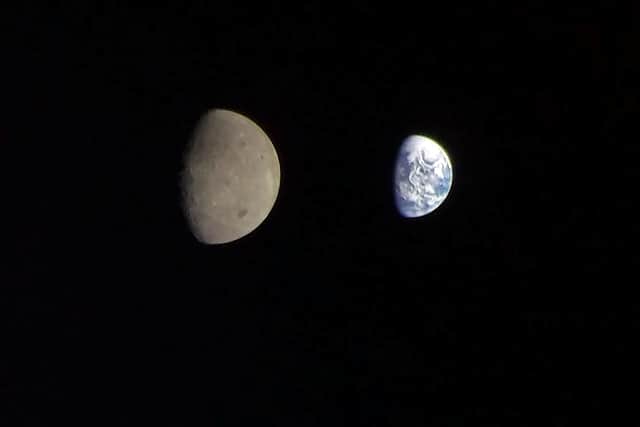 Wish you were here? The image sent back to NASA from the Orion appears to show the Moon eclipsing the Earth.