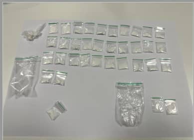 <p>The haul of drug wraps found in the vehicle.</p>
