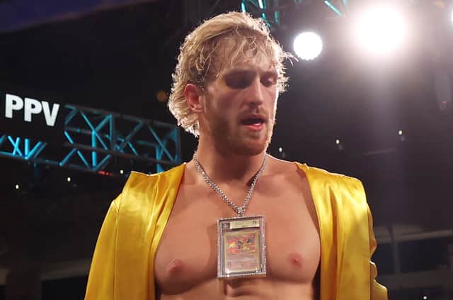 Logan Paul, seen here wearing a Charizard Pokemon Card, is the current owner of the most expensive Pokemon card to be sold