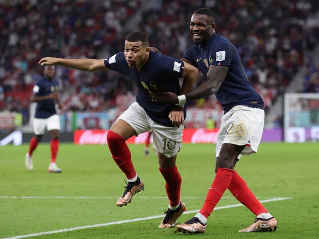 Marcus Thuram (right) celebrates with France teammate Kylian Mbappe (left) at the FIFA World Cup in Qatar.