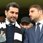 Newcastle United directors Mehrdad Ghodoussi (L) and Jamie Reuben react in the stands ahead of English Premier League football match between Chelsea and Newcastle United at Stamford Bridge in London on March 13, 2022. 