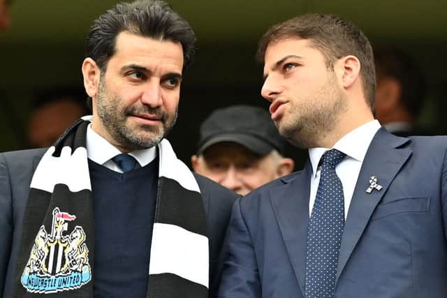 Newcastle United directors Mehrdad Ghodoussi (L) and Jamie Reuben react in the stands ahead of English Premier League football match between Chelsea and Newcastle United at Stamford Bridge in London on March 13, 2022. 