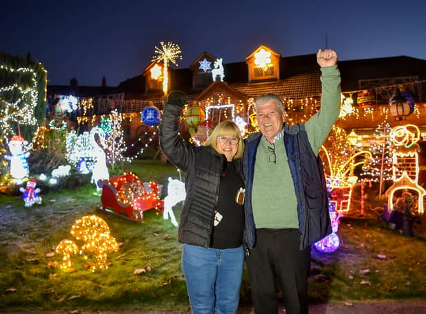 <p>Malcolm Molloy, 64, and his wife Wendy, 62, from Worcestershire wow their neighbours with Christmas lights every year</p>