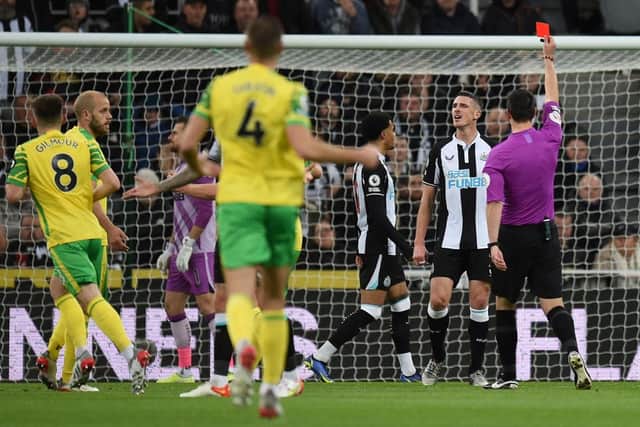 Ciaran Clark is sent off against Norwich City. (Photo by OLI SCARFF/AFP via Getty Images)