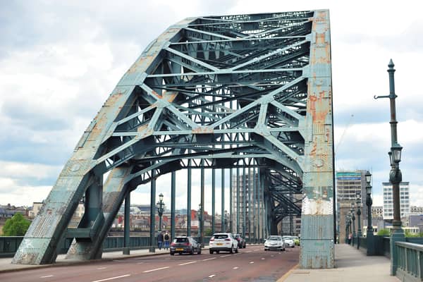 The iconic Tyne Bridge on the River Tyne between Newcastle and Gateshead which is in an alarming state, covered in rust patches and grafitti.