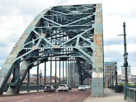 The iconic Tyne Bridge on the River Tyne between Newcastle and Gateshead which is in an alarming state, covered in rust patches and grafitti.