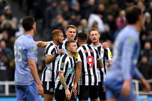 Callum Wilson, Joelinton, Kieran Trippier and Sean Longstaff of Newcastle United celebrate after Adam Smith (not in frame) of AFC Bournemouth scores an own goal during the Carabao Cup Fourth Round match between Newcastle United and AFC Bournemouth at St James' Park on December 20, 2022 in Newcastle upon Tyne, England. (Photo by Stu Forster/Getty Images)