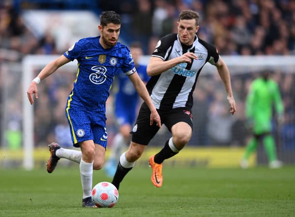 Jorginho holds off Chris Wood during the Premier League match between Chelsea and Newcastle United at Stamford Bridge (Photo by Justin Setterfield/Getty Images)