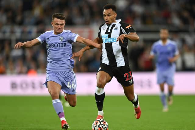 Jacob Murphy holds off the challenge of Jamie Shackleton  during the Premier League match between Newcastle United and Leeds United  (Photo by Stu Forster/Getty Images)