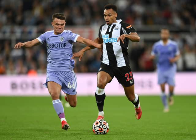 Jacob Murphy holds off the challenge of Jamie Shackleton  during the Premier League match between Newcastle United and Leeds United  (Photo by Stu Forster/Getty Images)