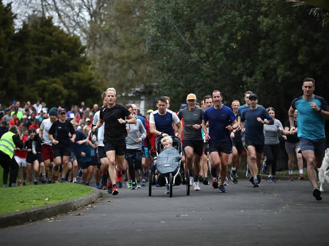 AUCKLAND, NEW ZEALAND - JULY 04: People run the 5km Parkrun around Western Springs Park on July 04, 2020 in Auckland, New Zealand. Parkrun events across New Zealand have resumed following their temporary suspension due to COVID-19. New Zealand is the only country in the world where the event is running at present due to the ongoing coronavirus pandemic. Parkrun is a free weekly 5km morning run or walk for people of all ages and abilities, with events held all over the world. (Photo by Phil Walter/Getty Images)